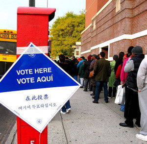 a long line of people waiting to vote