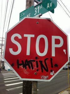 Stop sign modification stop sign modification graffiti adding "hatin !" under the sign printed STOP