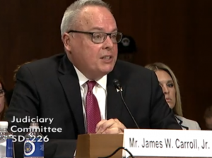 James W. Carroll, Jr. during his confirmation hearing before the Senate Judiciary Committee James W. Carroll, Jr. during his confirmation hearing before the Senate Judiciary Committee