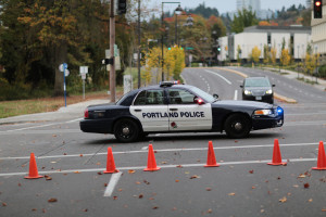 (Wikimedia Commons) A Portland Police Crown Victoria vehicle blocking an intersection behind several orange traffic cones